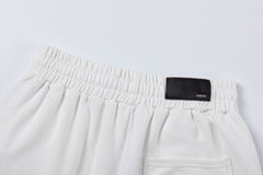AMIRI logo-embellished cotton track Shorts